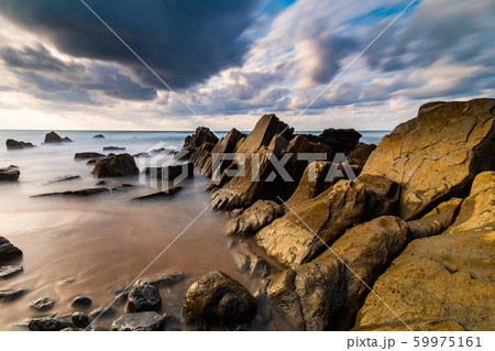Flysch rocks in Barrika beach at the sunset. Travel in Spain. 59975161