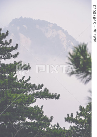 Peak covered in fog as seen from Huashan mountain Peak covered in fog as seen from Huashan mountain 59978023