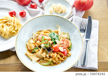 Italian pasta with seafood and tomato sauce. Pasta Gamberini. Close-up tagliatelle wind it around a 59978392