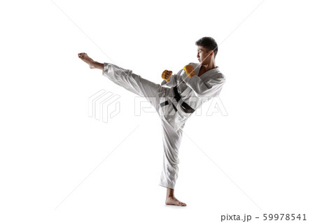 Confident korean man in kimono practicing hand-to-hand combat, martial arts 59978541