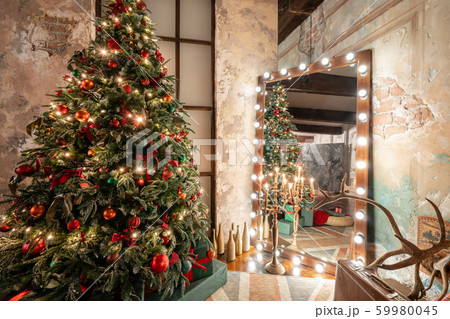 Winter home decor. Christmas in loft interior against brick wall. gifts under the tree. star lamp 59980045