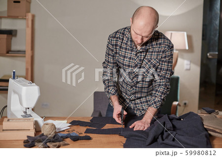 Tailor cutting wool fabric. the line pattern. Craftsman Makes rectangular blanks for Bow ties of 59980812