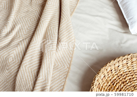 Winter mood, festive decoration of the bed in the bedroom. Christmas decor Still life details in the home interior. Winter mood, festive decoration of the bed in the bedroom. Christmas decor Still life details in the home interior. 59981710