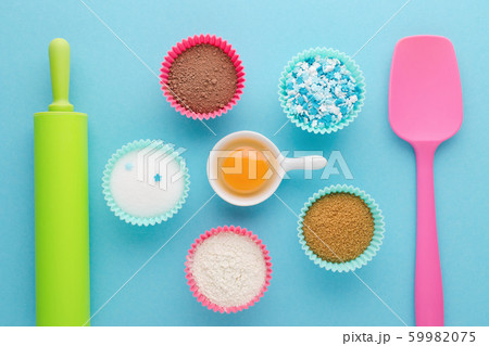 ingredients for baking and kitchen tools on blue background, flat lay ingredients for baking and kitchen tools on blue background, flat lay 59982075