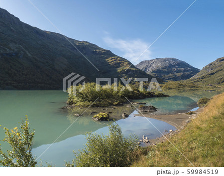 Milky blue glacial water of Lake Bovertunvatnet in Milky blue glacial water of Lake Bovertunvatnet in 59984519