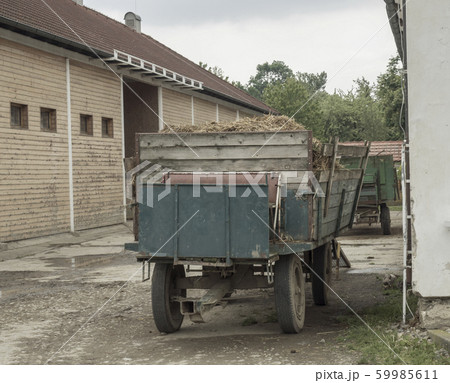 old truck with straw standing in front on barn, old truck with straw standing in front on barn, 59985611