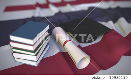 Graduation cap, books and diploma on the Thai flag. Higher education in Thailand related conceptual 3D rendering 59986159