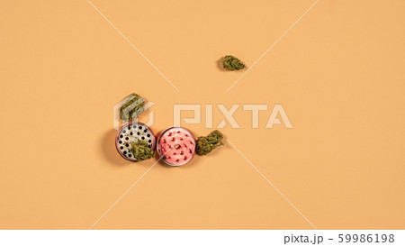 Top view of grinder with fresh marijuana buds on 59986198