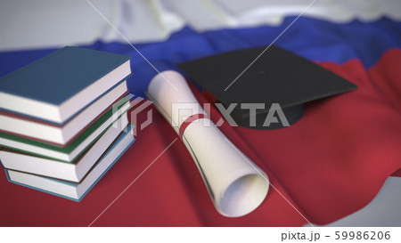 Graduation cap, books and diploma on the Russian flag. Higher education in Russia related conceptual 3D rendering 59986206