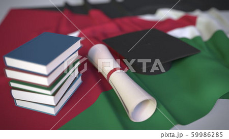 Graduation cap, books and diploma on the Jordanian flag. Higher education in Jordan related conceptual 3D rendering 59986285