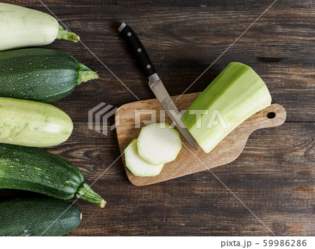 Zucchini harvesting concept. Zucchini harvesting concept. 59986286
