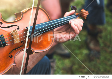 Violin played outdoors in a popular country party Violin played outdoors in a popular country party 59989688