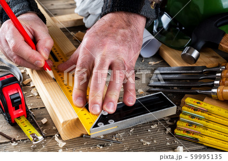 Craftsman at work on wooden boards. Carpentry. Craftsman at work on wooden boards. Carpentry. 59995135