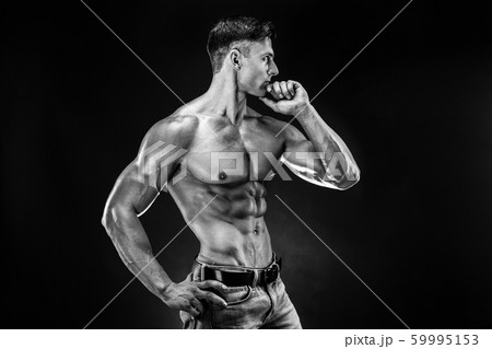 bodybuilder posing. Beautiful sporty guy male power. Fitness muscled man bodybuilder posing. Beautiful sporty guy male power. Fitness muscled man 59995153
