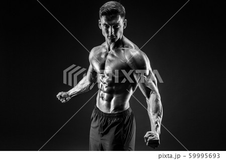 bodybuilder posing. Beautiful sporty guy male power. Fitness muscled man 59995693
