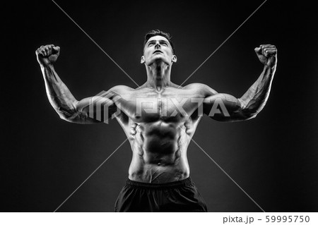 bodybuilder posing. Beautiful sporty guy male power. Fitness muscled man bodybuilder posing. Beautiful sporty guy male power. Fitness muscled man 59995750