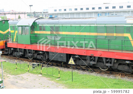 Green metallic iron wheeled freight train, 59995782
