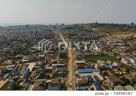 Cars traffic in Sihaoukville city streets, Drone shot 59996587