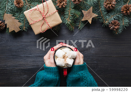 Christmas composition of fir branches, wooden toys Christmas composition of fir branches, wooden toys 59998220