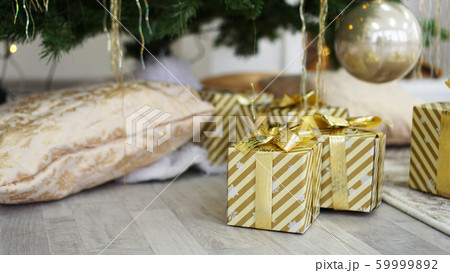 Boxes of presents under the Christmas tree Boxes of presents under the Christmas tree 59999892
