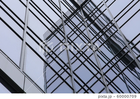 Abstract business modern city urban futuristic architecture background, motion blur, reflection in glass of high rise skyscraper facade, toned blue picture with bokeh. Real estate concept Abstract business modern city urban futuristic architecture background, motion blur, reflection in glass of high rise skyscraper facade, toned blue picture with bokeh. Real estate concept 60000709