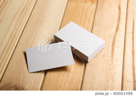 Business card blank on wooden background. Corporate Stationery, Branding Mock-up. Creative designer desk. Flat lay. Copy space for text Business card blank on wooden background. Corporate Stationery, Branding Mock-up. Creative designer desk. Flat lay. Copy space for text 60001498
