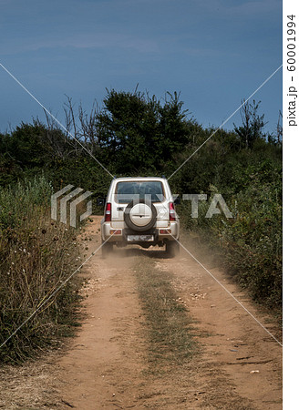 Cross Country Vehicle SUV On Dusty Gravel Road In Croatia 60001994
