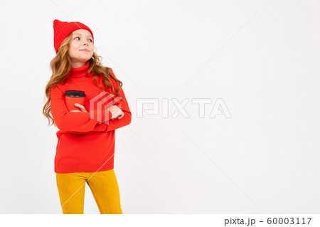 European pretty girl in red posing with a glass of coffee in her hands on a white background 60003117
