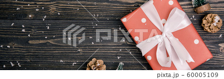 Christmas holiday composition with red gift box decoration on wooden background Christmas holiday composition with red gift box decoration on wooden background 60005109