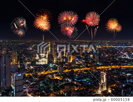 Fireworks celebrating over Bangkok cityscape at 60005158