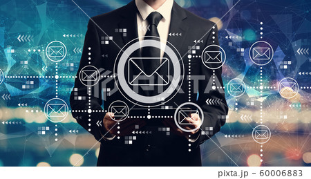 Email concept with businessman holding a tablet 60006883