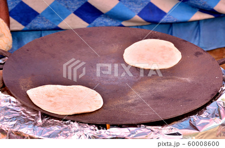 Tawa roti Indian food circular pan bread arrest Tawa roti Indian food circular pan bread arrest 60008600