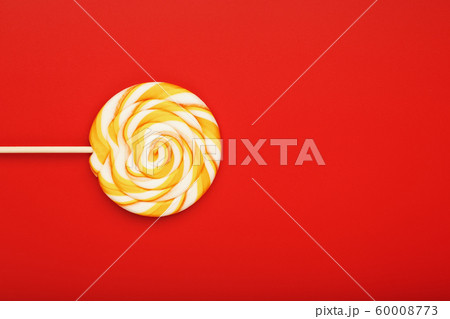 Colorful round Lollipop, on red background. Colorful round Lollipop, on red background. 60008773