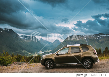 Utvik, Sogn Og Fjordane County, Norway. Car Suv Parked Near Scenic Route Road In Norwegian Mountain Lake Landscape. Innvikfjord Is A Sub-fjord Of Nordfjord. 60009184