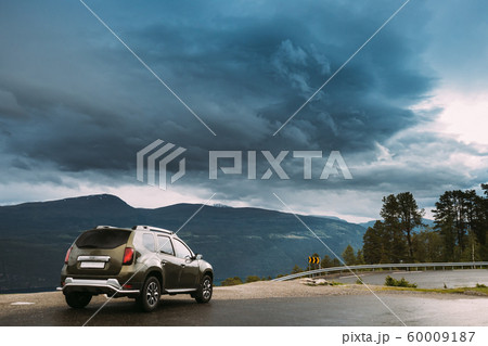 Utvik, Sogn Og Fjordane County, Norway. Car Suv Parked Near Scenic Route Road In Norwegian Mountain Lake Landscape. Innvikfjord Is A Sub-fjord Of Nordfjord. 60009187