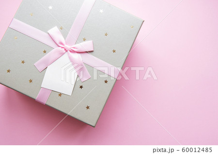 Gift box on pink background Gift box on pink background 60012485