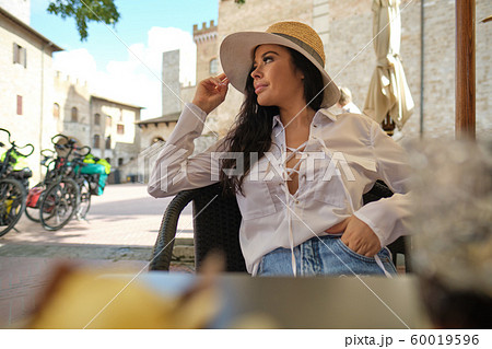 beautiful woman in summer dress walking and 60019596