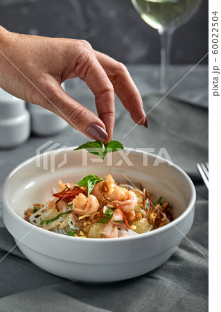 Rice noodles with shrimps and seafood, spicy asian style noodles in bowl. 60022504