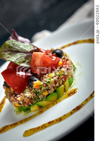 Delicious quinoa salad with avocado and tomatoes. Macro. Delicious quinoa salad with avocado and tomatoes. Macro. 60022661