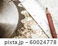 Saw Blade and Woodwork tools on the boards background 60024778