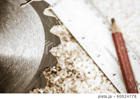 Saw Blade and Woodwork tools on the boards background 60024778