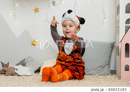 Beautiful happy boy in a suit in the New Year 60025165