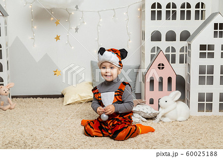 Beautiful happy boy in a suit in the New Year 60025188