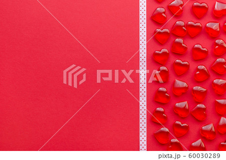 red background with hearts pattern and copy space red background with hearts pattern and copy space 60030289