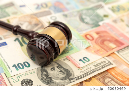 Gavel on banknotes. Law, corruption concept Gavel on banknotes. Law, corruption concept 60030469