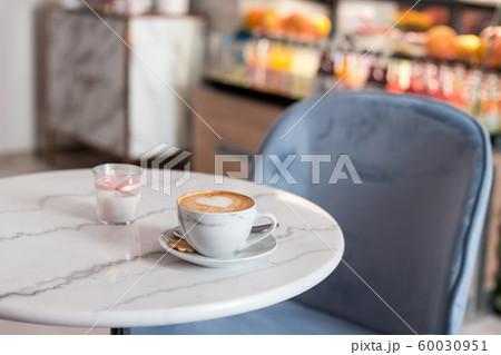 Cup of coffee with beautiful Latte art. Hot coffee in cafe, morning time. Food concept 60030951