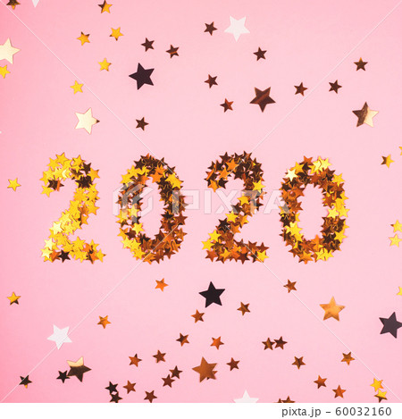 2020 New Year symbol of gold confetti on pink 2020 New Year symbol of gold confetti on pink 60032160