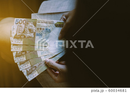 Hands bussiness woman counting five hundred Hong Kong banknotes,Close up Hands bussiness woman counting five hundred Hong Kong banknotes,Close up 60034681