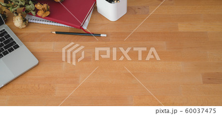 Top view of comfortable workplace with laptop Top view of comfortable workplace with laptop 60037475