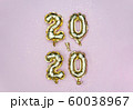 Vertical 2020 Happy New year celebration. Gold foil balloons numeral 2020 and golden stars on pastel 60038967